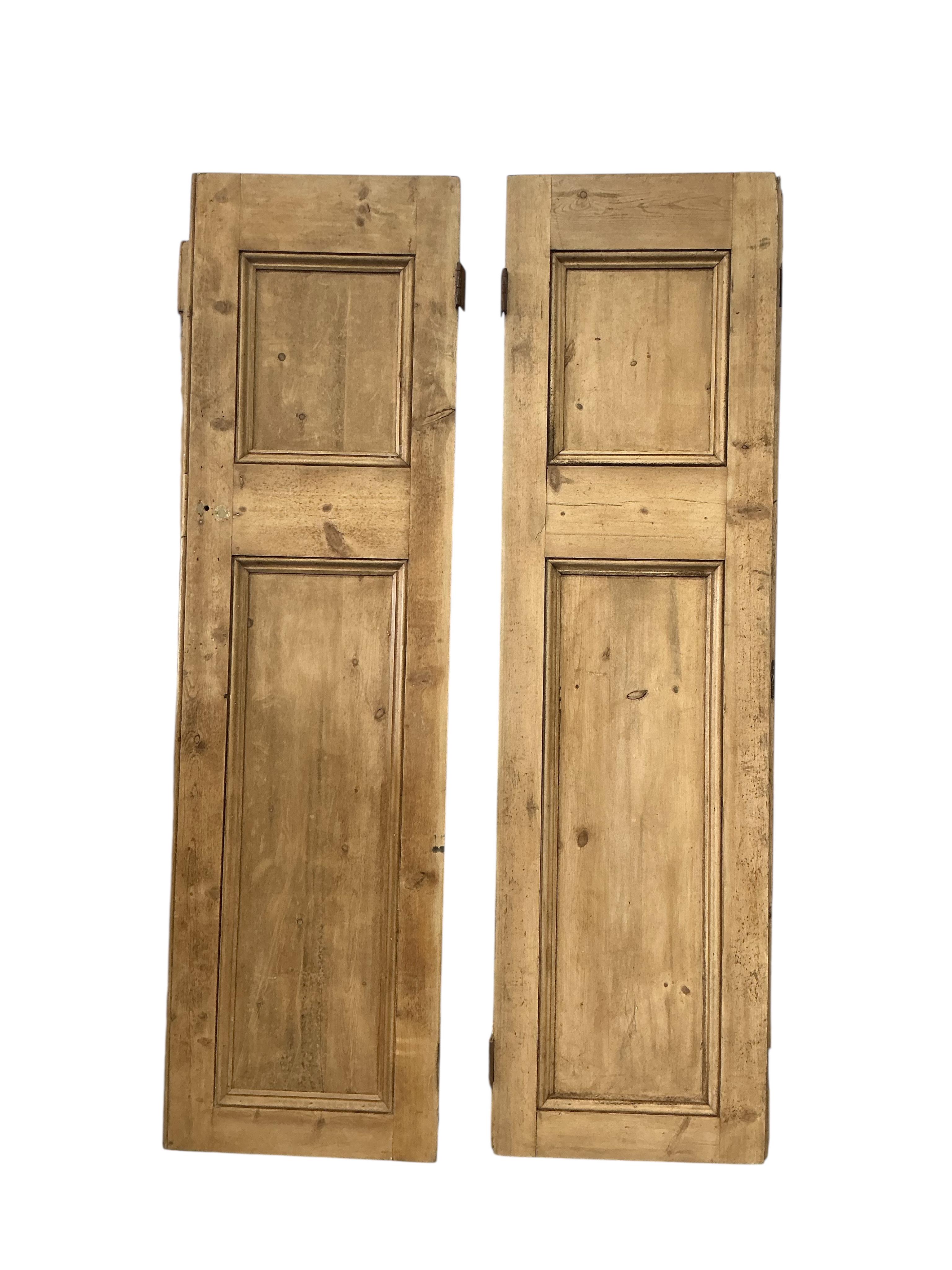 Three 19th century panelled pine shutters and a pair of similar small shutters, largest width 68cm, height 234cm